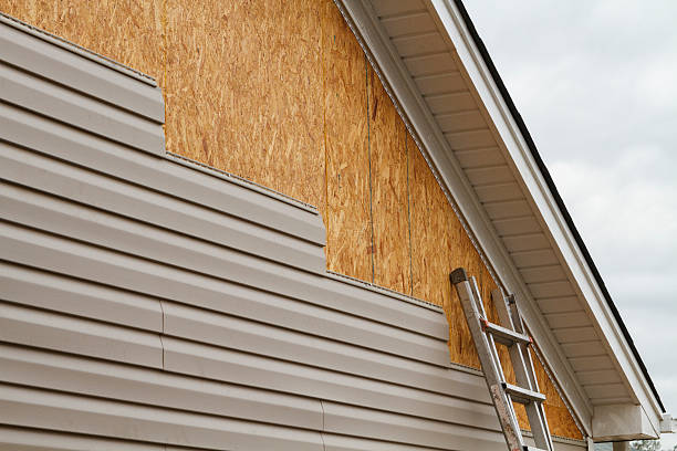 Professional Siding Contractor technician working in Babson Park, MA